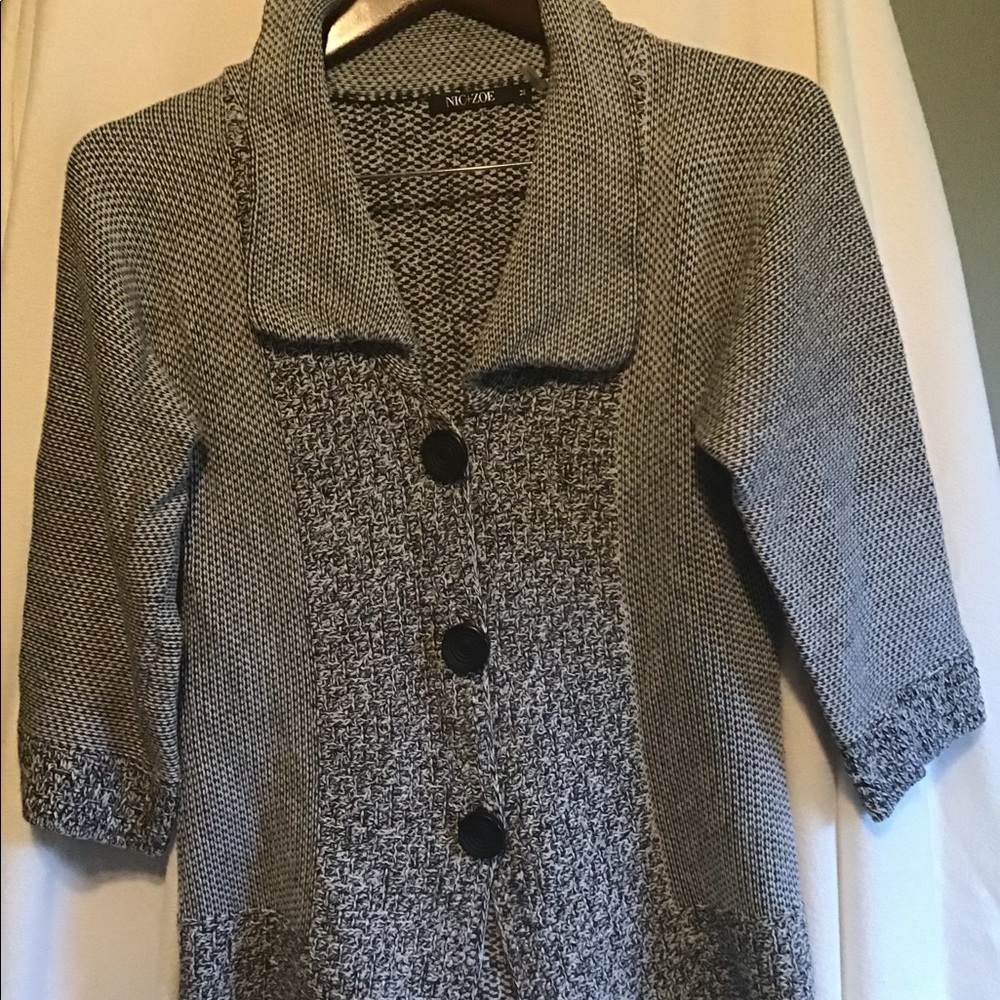 Knit cardigan sweater.